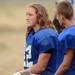 Lincoln senior Bryton Boyle looks on from the sideline during a practice at the school on Thursday. Boyle has been growing out his hair for two years in hopes of donating it to Locks of Love in honor of his little brother who had cancer at a young age. Melanie Maxwell I AnnArbor.com